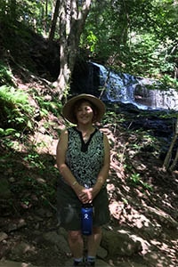 woman hiking Rickett's Glen State Park Falls Trail